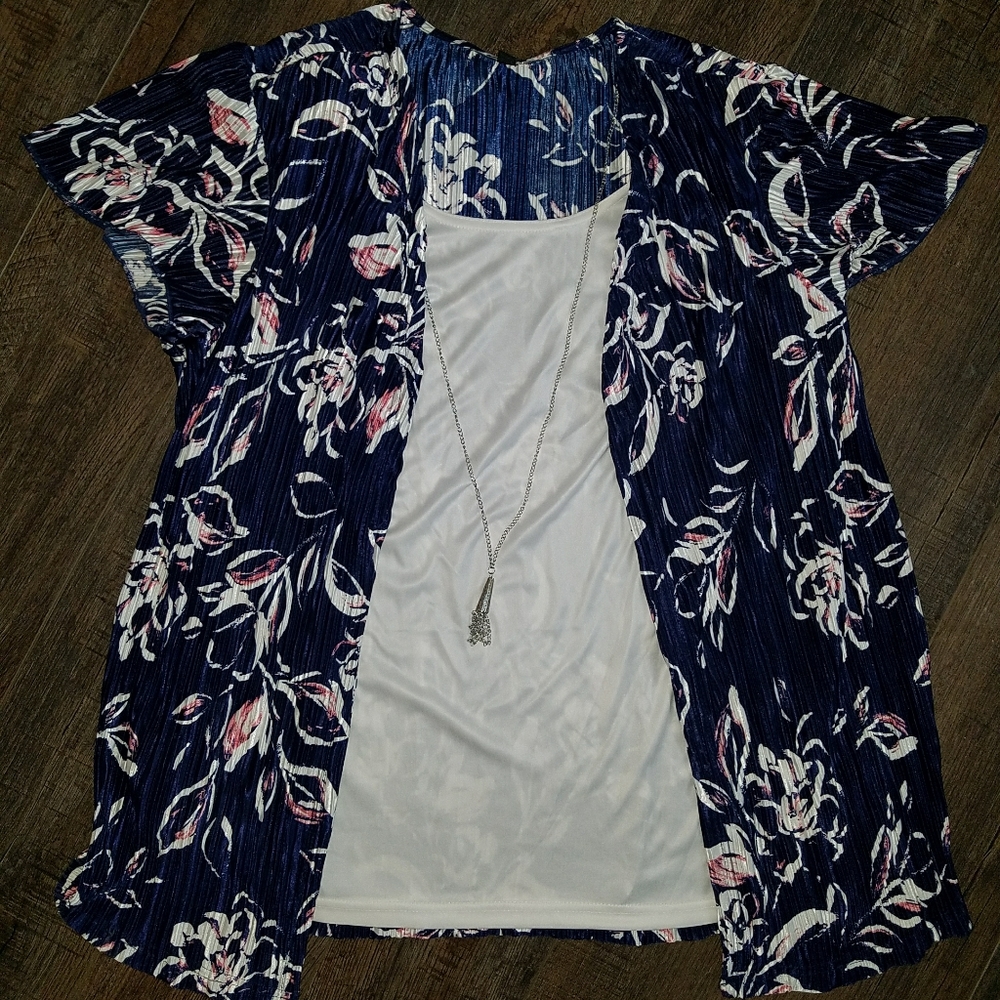 Floral, silky blouse with removable necklace.